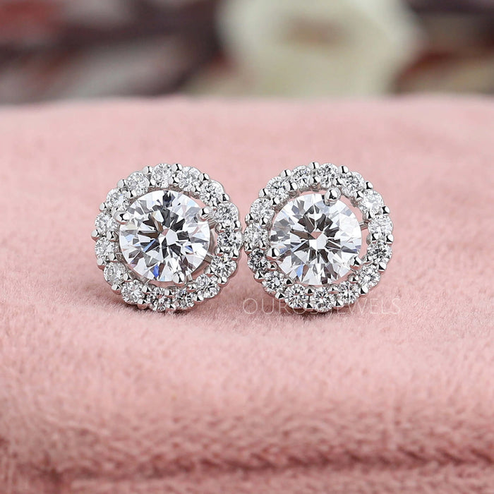 front view of round cut lab grown diamond white gold stud earrings halo
