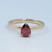 front view of garnet pear-cut gemstone solitaire engagement ring