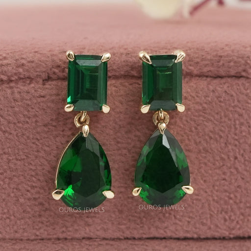 front view of green emerald and pear gemtsone prong setting drop earrings