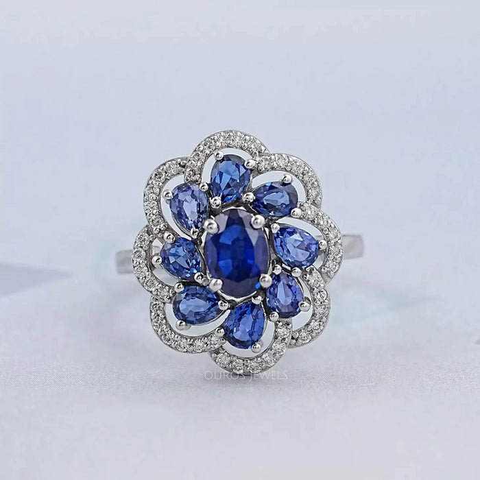 blue sapphire oval diamond floral halo engagement ring's front view