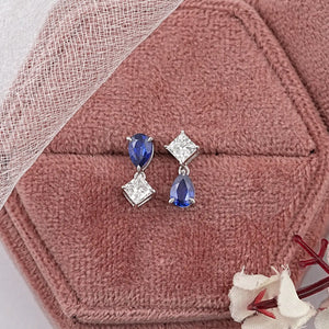 Boucles d'oreilles à deux pierres en saphir poire et diamant princesse