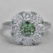 top view of green cushion cut lab diamond halo engagement ring