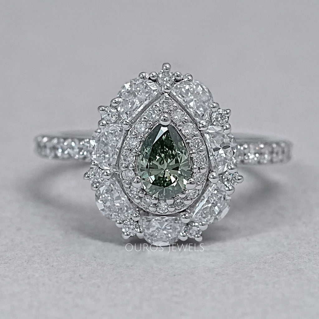 front view of green pear cut surround double halo diamond engagement ring