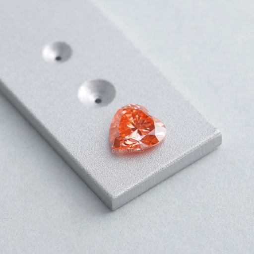0.90ct vivid pink heart shaped lab made diamond loose on matte material