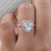 front view of heart-shaped diamond pink halo engagement ring