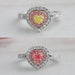 couple of heart shaped yellow and pink diamond double halo engagement ring