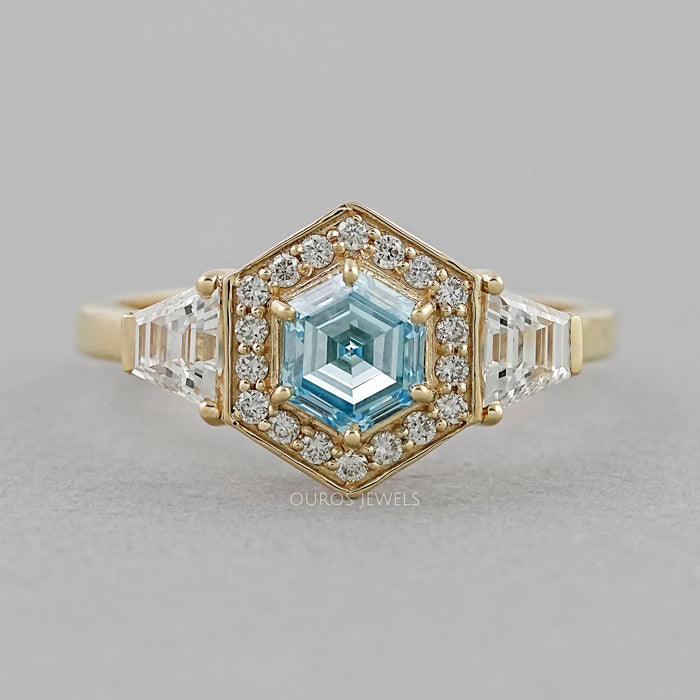 front view of blue hexagon-cut lab diamond halo 3-stone colored engagement ring