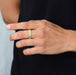 baguette cut lab grown diamond mens wedding ring yellow gold on model's finger