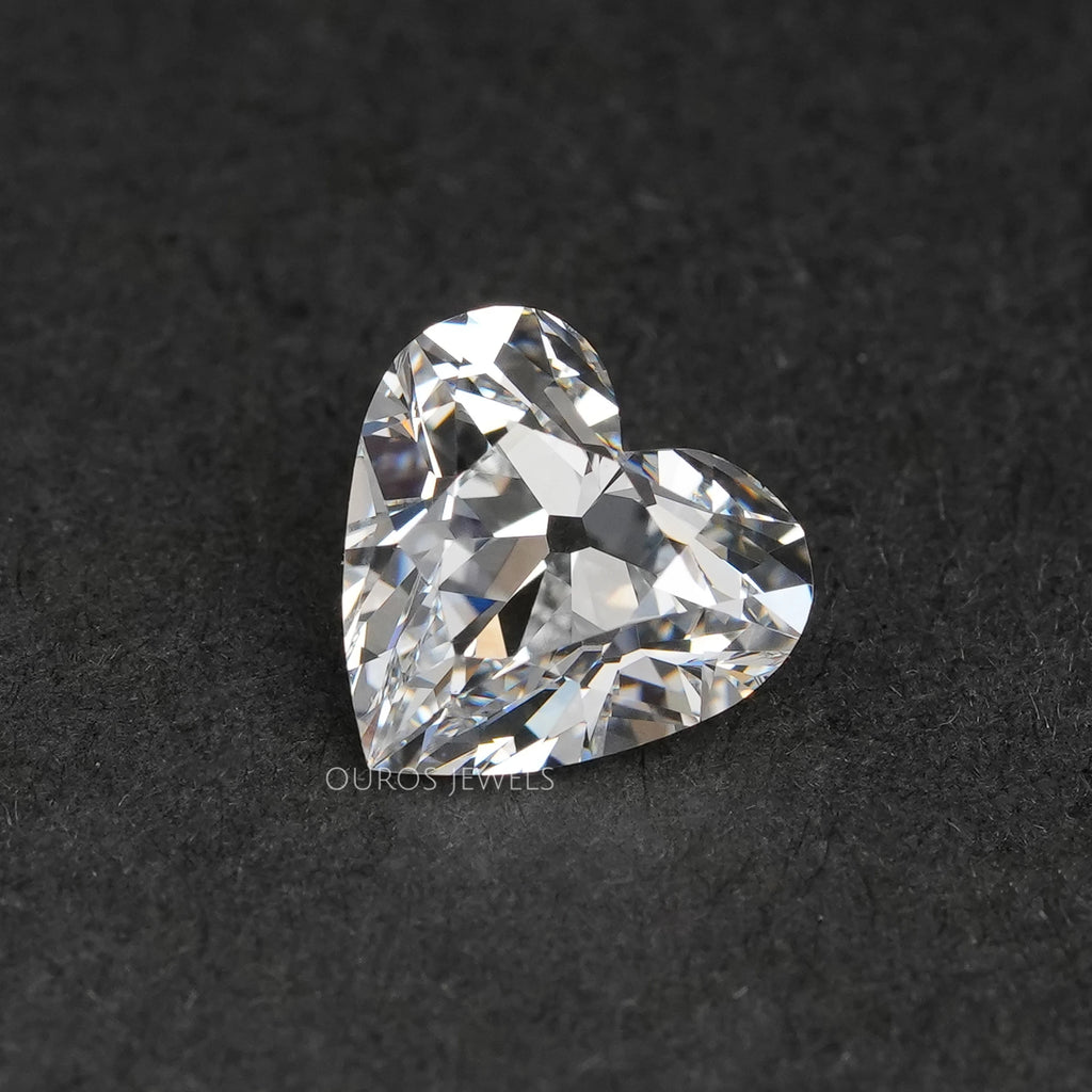 front view of old mine heart cut lab grown diamond on black fabric