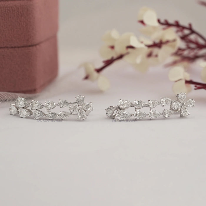 side view of pear shaped lab made diamond dangle drop earrings sterling silver