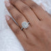 cushion cut lab diamond halo engagement ring in finger