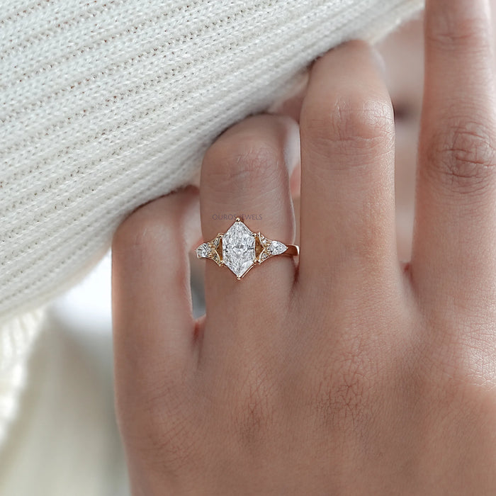 dutch marquise cut lab diamond three stone engagement ring on model's finger