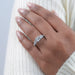 princess cut lab grown diamond five stone engagement ring on model's finger