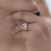 pink marquise cut diamond bypass engagement ring yellow gold in model's hand