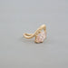 side view of pink marquise cut diamond bypass engagement ring yellow gold band