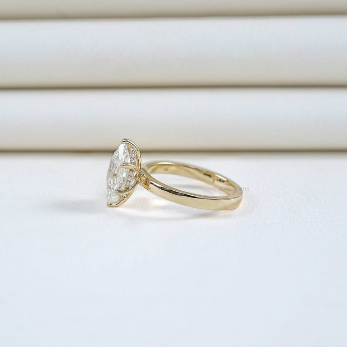 side angle view of dutch marquise cut diamond hidden halo engagement ring