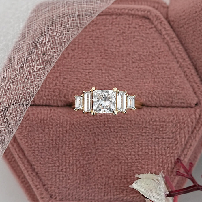 princess and baguette cut lab diamond five stone engagement ring in jewelry box