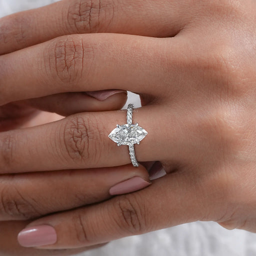 front view of marquise-cut diamond solitaire accent engagement ring in finger