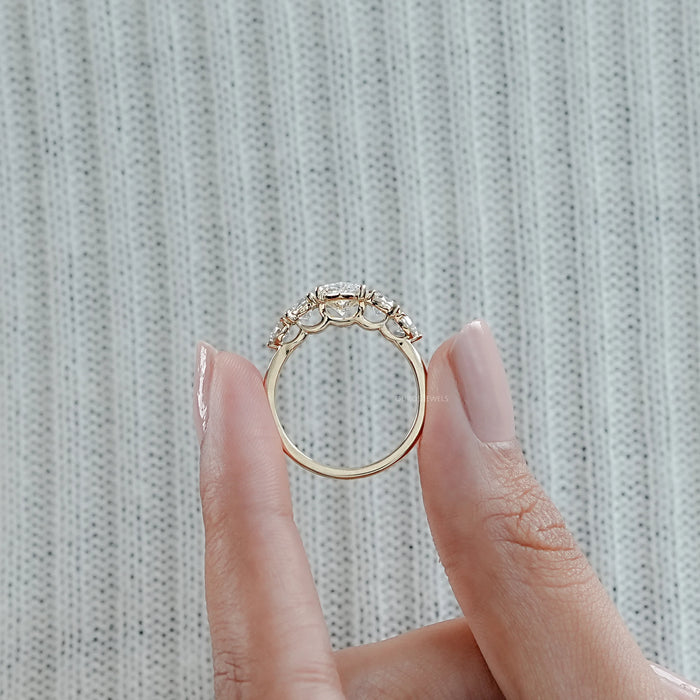 close view of marquise and round cut lab diamond five stone engagement ring