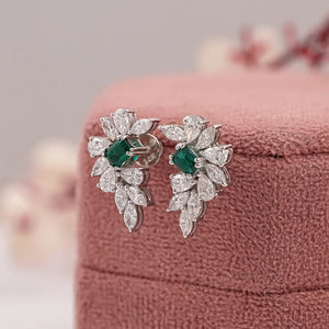 emerald gemstone and cluster diamond earrings