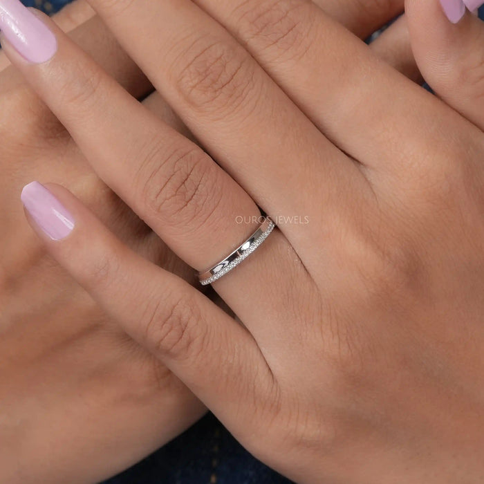 round man made diamond half eternity plain silver wedding band in finger