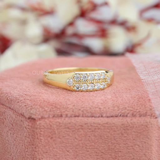 round cut lab diamond yellow gold men's engagement band on jewelry box