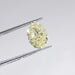 Yellow Oval Cut Diamond in a Tweezer 