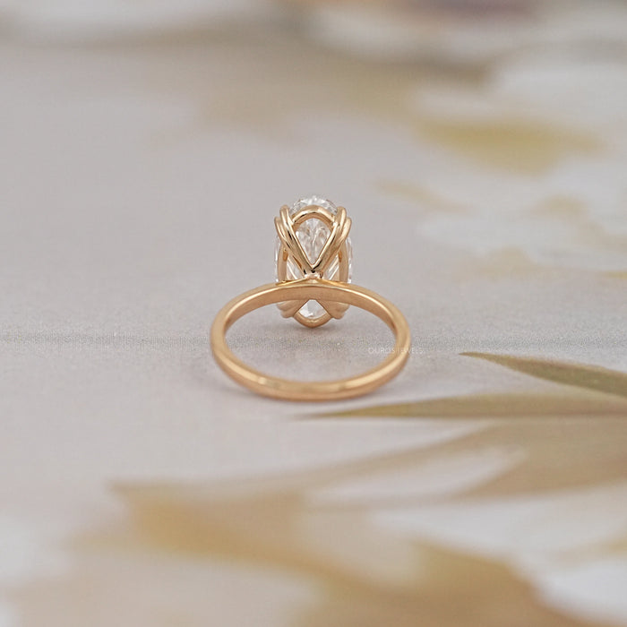 back view of old mine moval diamond double prong engagement ring in yellow gold band