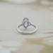 back view of old mine moval cut lab diamond split shank wedding ring on grey fabric