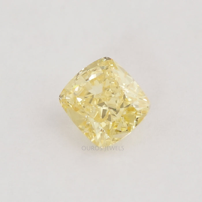 front view of yellow cushion shaped loose lab grown diamond
