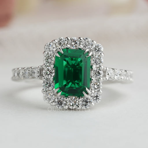 front view of green emerald cut lab diamond halo engagement ring white gold