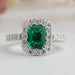 front view of green emerald cut lab diamond halo engagement ring white gold
