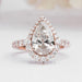 top view of pear cut lab diamond halo engagement ring in rose gold band
