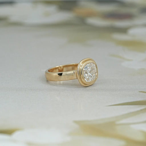 right side view of old mine cushion cut lab diamond bezel set engagement ring