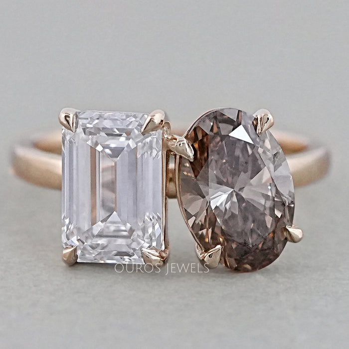 front view of emerald and champagne oval-cut diamond toi et moi engagement ring