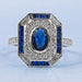 blue oval and baguette cut halo gemstone engagement ring's front view