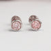 front view of pink round lab grown diamond bezel set stud earrings rose gold