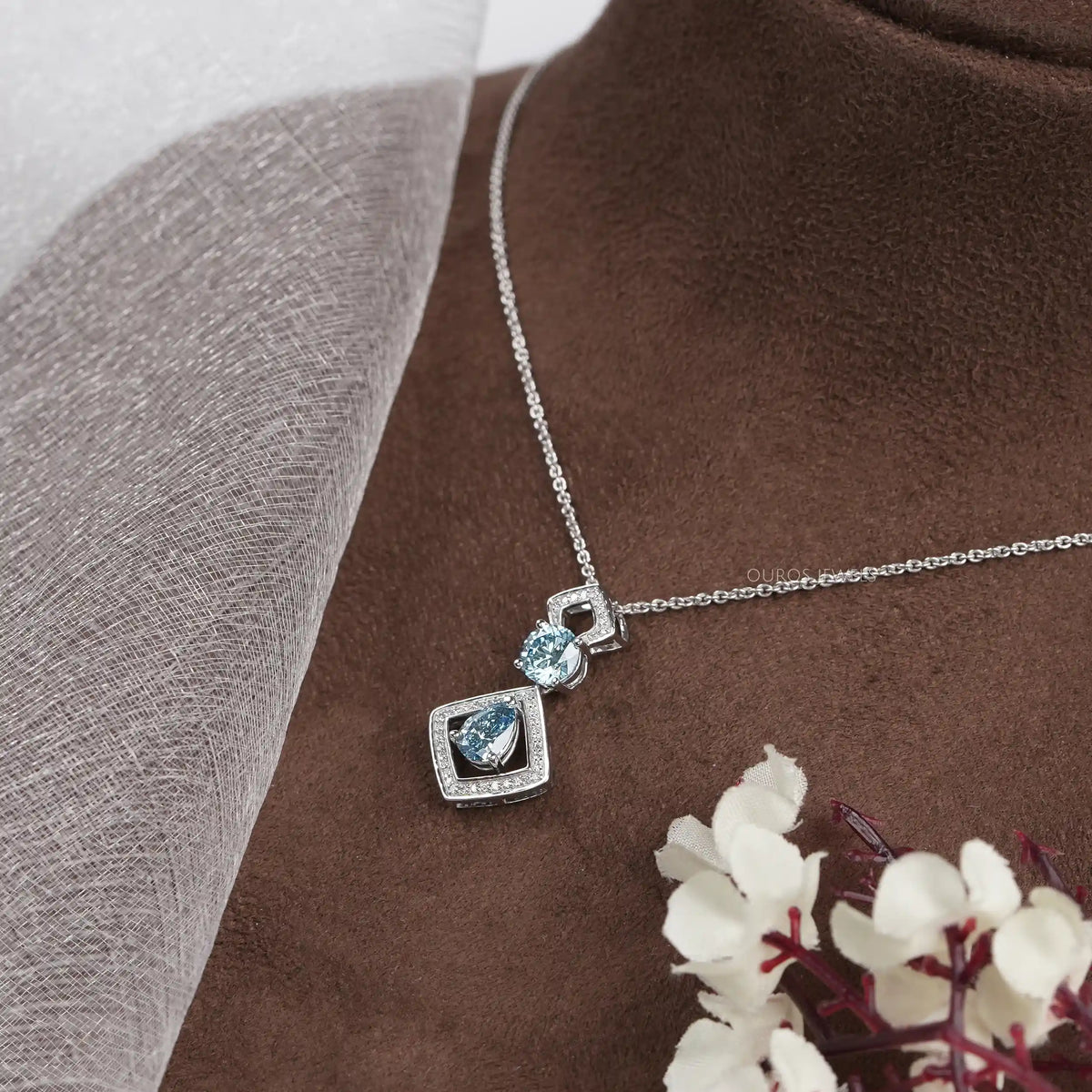 Blue Pear And Round Diamond Floating Pendant Necklaces