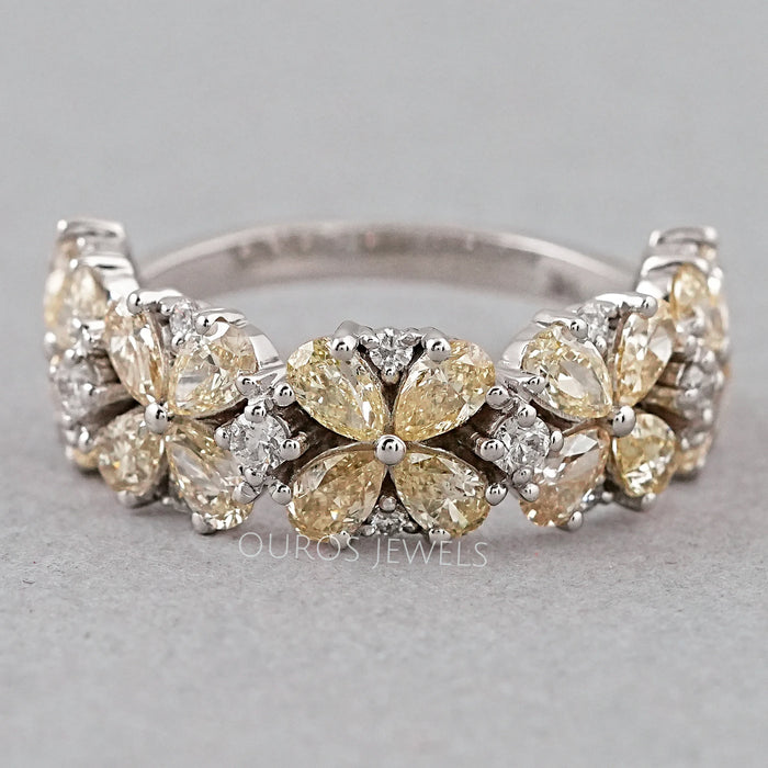 front view of floral shape yellow pear-cut lab diamond colored engagement ring