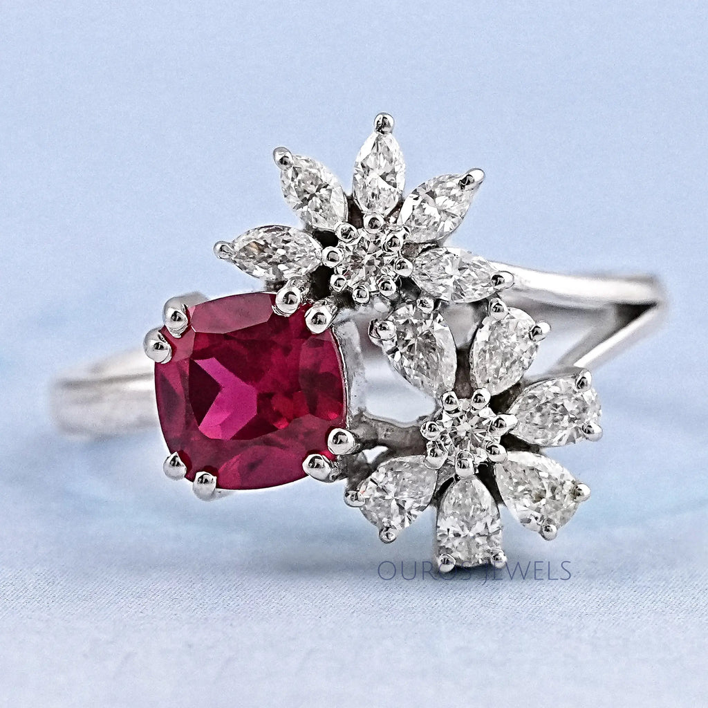 front view of cushion cut ruby with pear & marquise diamond split shank engagement ring