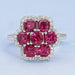 top view of red ruby cushion cut & round diamond floral halo engagement ring
