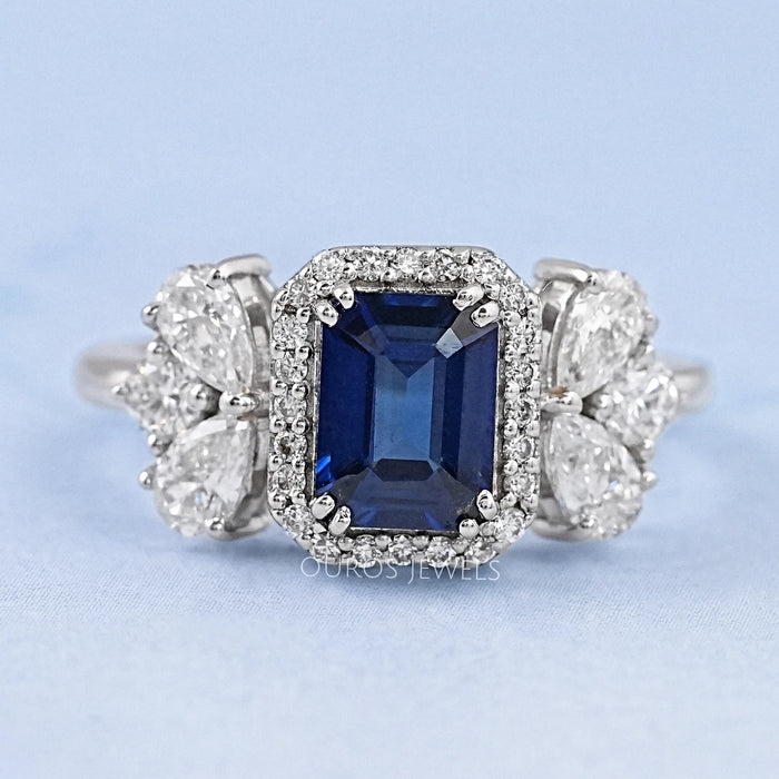 blue sapphire emerald diamond engagement ring  with halo accent's front view