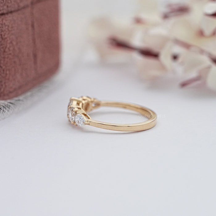 side view of round and pear cut lab diamond five stone engagement ring