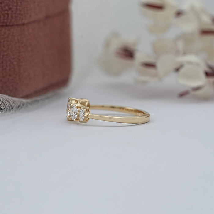 side view of round and marquise cut lab diamond five stone engagement ring