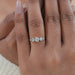round and marquise cut lab diamond five stone engagement ring in finger
