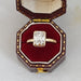 old mine cushion cut diamond hidden halo engagement ring in jewelry box