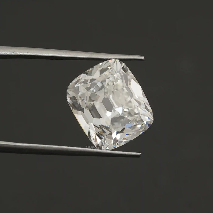 tweezer holding old mine cushion cut lab grown diamond