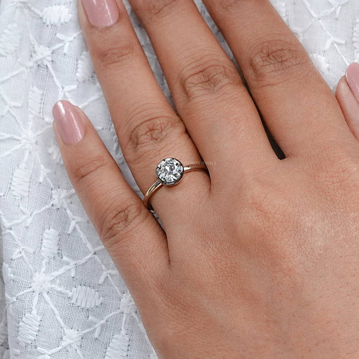 black coated old eauropean round lab diamond engagement ring solitaire in finger