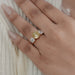 fancy yellow old mine cushion diamond three stone wedding ring in finger