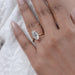 old mine moval diamond solitaire double prong engagement ring in finger